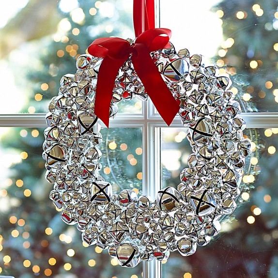 Wreath with jingle bells, white small berries and bird's nest